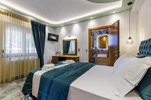 Ένα ή περισσότερα κρεβάτια σε δωμάτιο στο Luxury VILLA RAFAEL