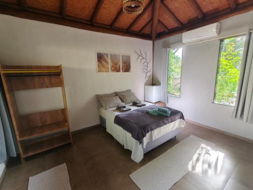 Ein Bett oder Betten in einem Zimmer der Unterkunft Casa Boa Energia