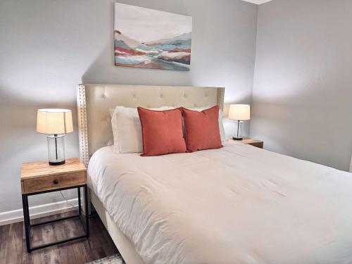 a bedroom with a large bed with two night stands at Restful Retreat with 4 Beds Sleeps 6 in Valdosta