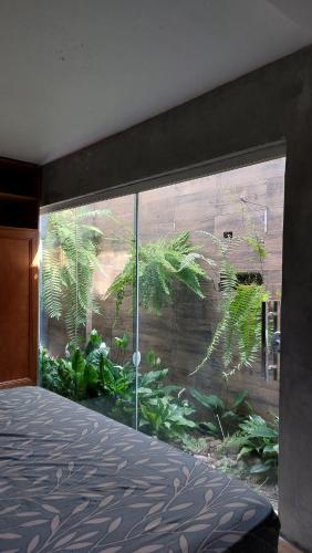 Ένα ή περισσότερα κρεβάτια σε δωμάτιο στο Casa aconchegante no Balneário de Ipanema