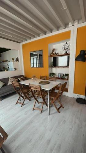 a dining room with a table and chairs at Fenais da Luz House in Fenais da Luz