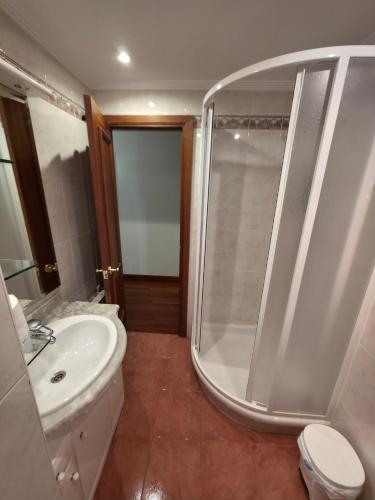 a bathroom with a shower and a toilet and a sink at Beach Big Apartment With 3 Rooms Apartment Parking Included in San Sebastián