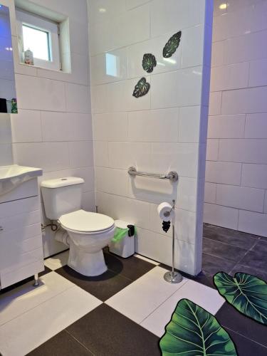 a bathroom with a toilet and a sink at The Pervoli Studio - Pool - Close to Beach in Larnaka
