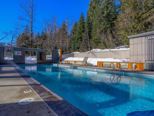 a large swimming pool with blue water at Thunderhead Lodge #301 - Meredith Lodging in Government Camp