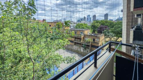a view of a river from a balcony of a building at Central London rooms EC1V in London
