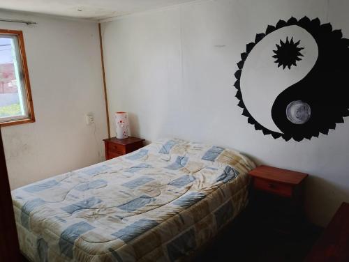 a bedroom with a bed and a mirror on the wall at China 18, Coquimbo in Coquimbo