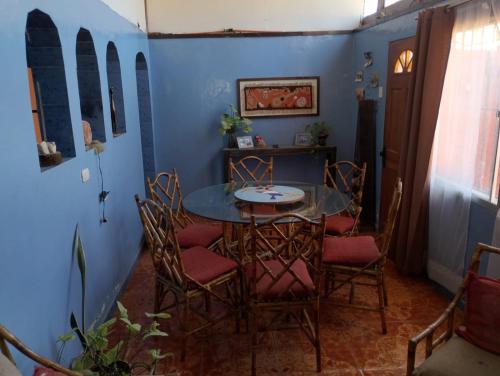 a dining room with a table and chairs at China 18, Coquimbo in Coquimbo
