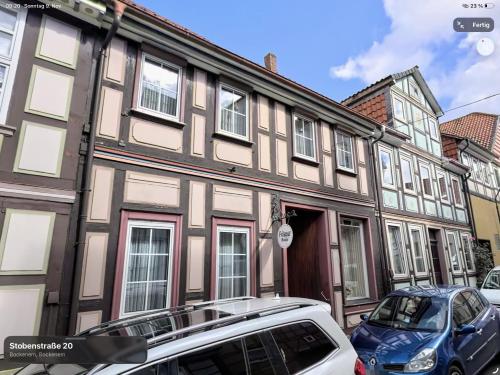 a building with cars parked in front of it at BB-Miklos in Bockenem