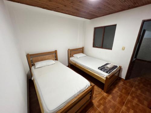 Ένα ή περισσότερα κρεβάτια σε δωμάτιο στο Amplio Apartamento con Vistas en Dosquebradas