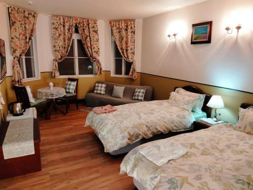 Postel nebo postele na pokoji v ubytování Utena Izukogen