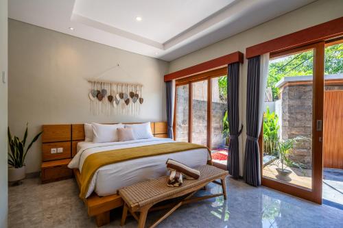 Ένα ή περισσότερα κρεβάτια σε δωμάτιο στο Semar Villa, a cozy studio Villa with a Private Pool, Bali
