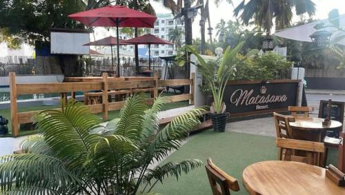 a restaurant with tables and chairs and a patio at Matasawa Resort - Wailoaloa, Nadi in Nadi