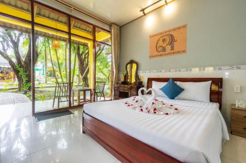 Voodi või voodid majutusasutuse Green Bungalow Garden Resort toas