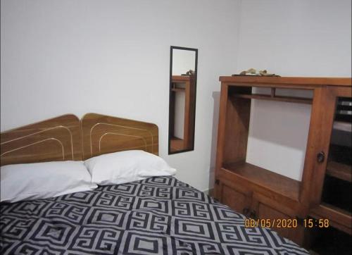 Ένα ή περισσότερα κρεβάτια σε δωμάτιο στο Villas San José , calido hogar ,cerca de la CAPU