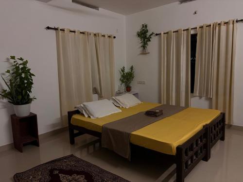 Cama o camas de una habitación en Villa Luna Varkala