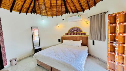 a bedroom with a bed in a room at Holiday Homestay dholavira 