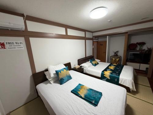 Postel nebo postele na pokoji v ubytování 福宿 Fukuinn 102号室