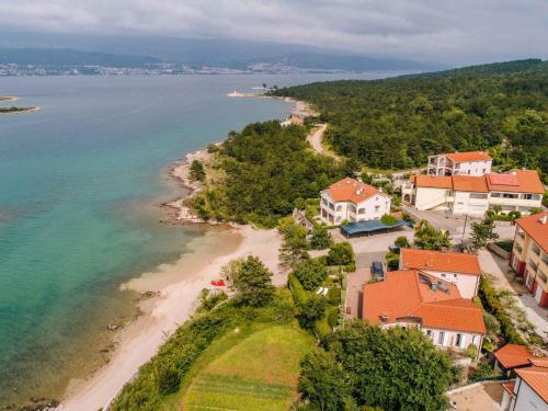 an aerial view of a beach with houses and the ocean at Apartments in Klimno - Insel Krk 42235 in Klimno