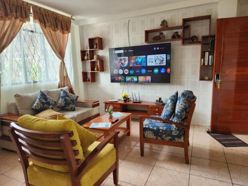 TV a/nebo společenská místnost v ubytování Departamento Puyo Fantastic.