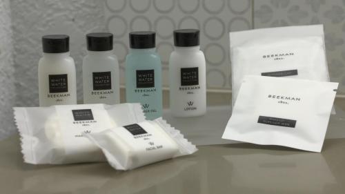 a group of four bottles oficating products sitting on a table at Country Inn & Suites by Radisson, Hagerstown, MD in Hagerstown