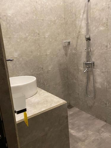 a bathroom with a shower and a sink at Nelumbo Villa 42 - oasis of relaxations in Uragasmanhandiya