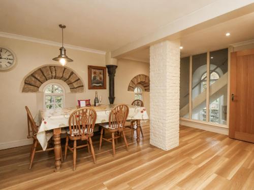 a kitchen and dining room with a table and chairs at 1 The Old Methodist Chapel in Rosedale Abbey