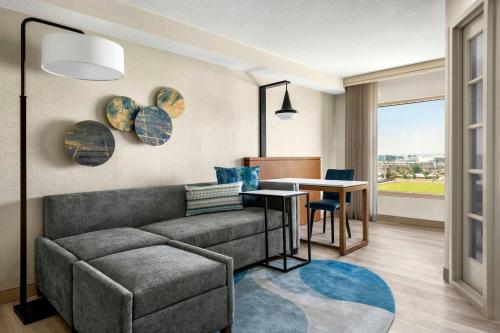 a living room with a couch and a table at Anaheim Marriott Suites in Anaheim