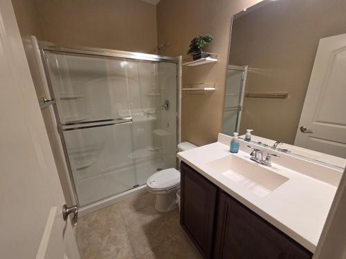 a bathroom with a shower and a sink and a toilet at Comfortable Family Getaway in Buckeye in Buckeye