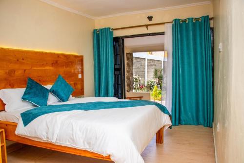 Postel nebo postele na pokoji v ubytování Keyman Address