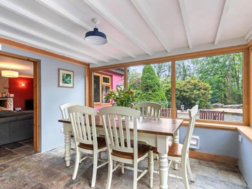 a dining room with a table and chairs at Mountain View in Llawhaden