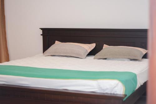 Ένα ή περισσότερα κρεβάτια σε δωμάτιο στο Avenue IX Beach View Apartment