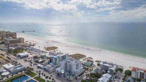 an aerial view of a beach and the ocean at Three Tides Apartments in Clearwater Beach