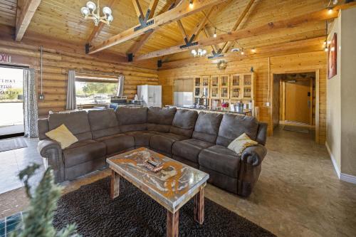 a living room with a couch and a coffee table at Ponderosa Inn in Escalante