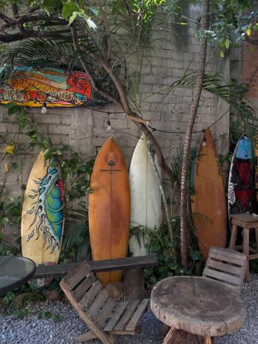 a group of surfboards leaned up against a wall at La Punta in Brisas de Zicatela