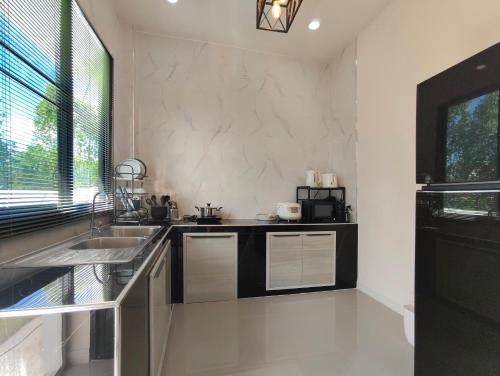 Η κουζίνα ή μικρή κουζίνα στο Botanic Wind