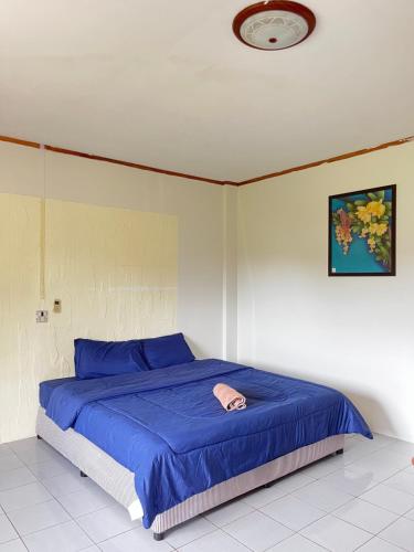 Ένα ή περισσότερα κρεβάτια σε δωμάτιο στο BUK LANTA