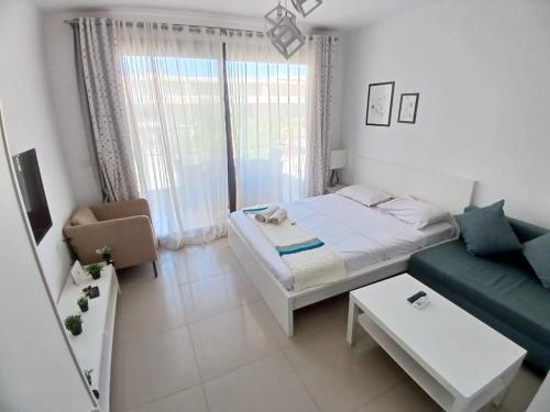 Ένα ή περισσότερα κρεβάτια σε δωμάτιο στο Hotel Apartment in G cribs