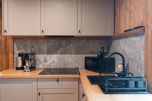 Η κουζίνα ή μικρή κουζίνα στο Ośrodek Wypoczynkowy Bernadetta