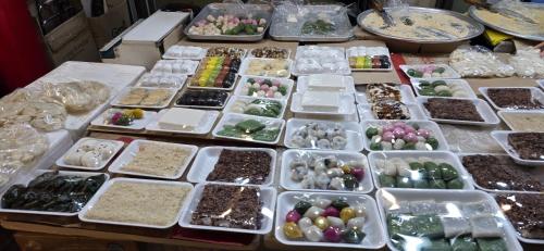 a table topped with white trays filled with different types of minerals at 연 스테이 in Seoul