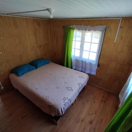 Postel nebo postele na pokoji v ubytování Cabañas Hualles de Huillinco