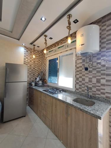 Kuchyň nebo kuchyňský kout v ubytování اقامة تورارن