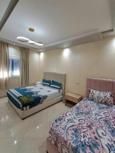 Postel nebo postele na pokoji v ubytování اقامة تورارن