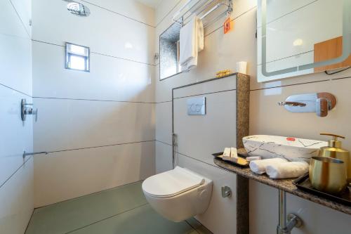 a bathroom with a toilet and a sink at The Munshi Mansion in Jodhpur