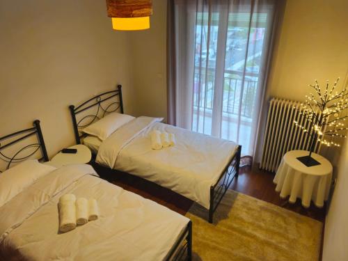 Ένα ή περισσότερα κρεβάτια σε δωμάτιο στο Calliope's Home