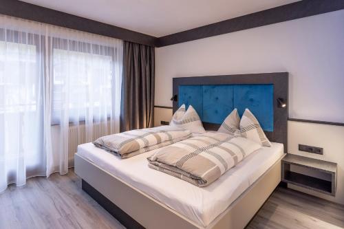 Postel nebo postele na pokoji v ubytování Sieglinde Color