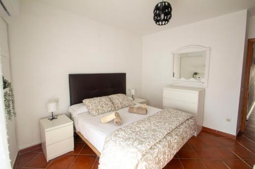 En eller flere senge i et værelse på Casa Centro Los Remedios