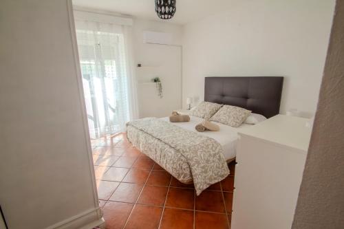 En eller flere senge i et værelse på Casa Centro Los Remedios