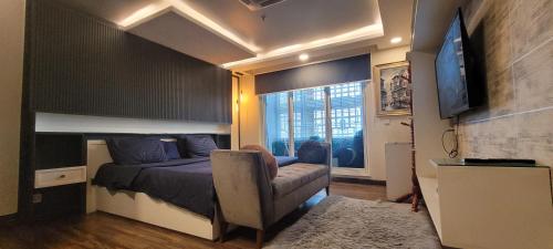 Ένα ή περισσότερα κρεβάτια σε δωμάτιο στο Goldcrest Hotel Apartments