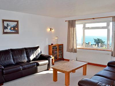 a living room with a couch and a coffee table at Ponsgwedhen in Coverack