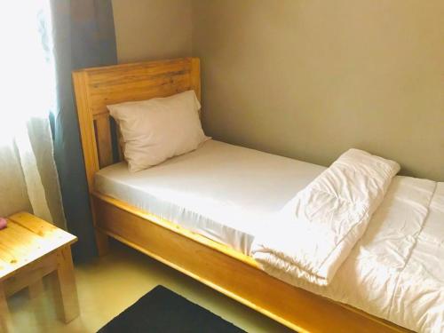 Ένα ή περισσότερα κρεβάτια σε δωμάτιο στο Tulivu house